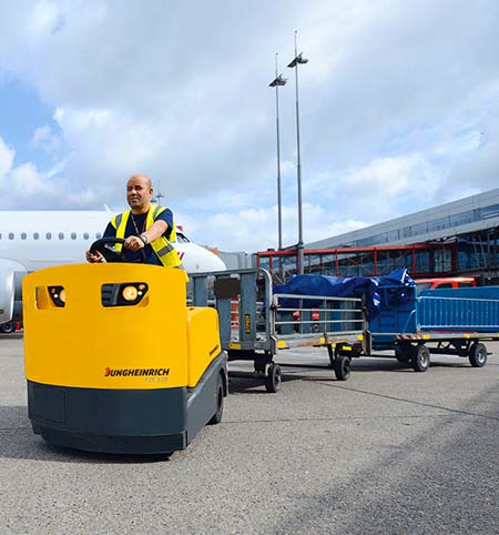 Driving an airport tow-tractor with trailer